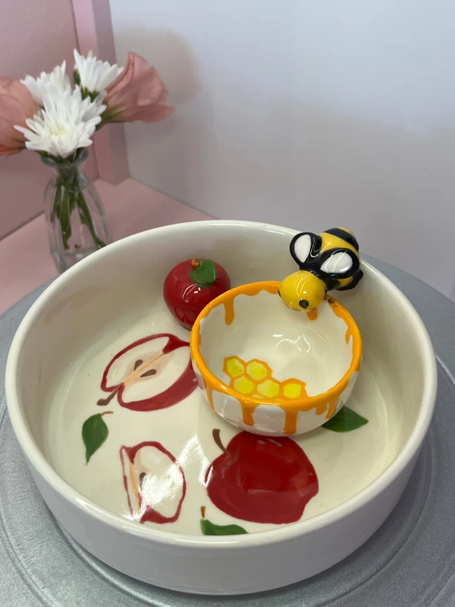 Bee figurine on a honey pot