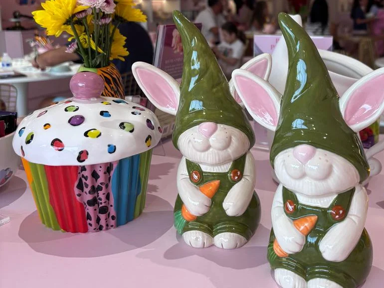 Hand-painted ceramic bunnies and a cupcake jar in the studio